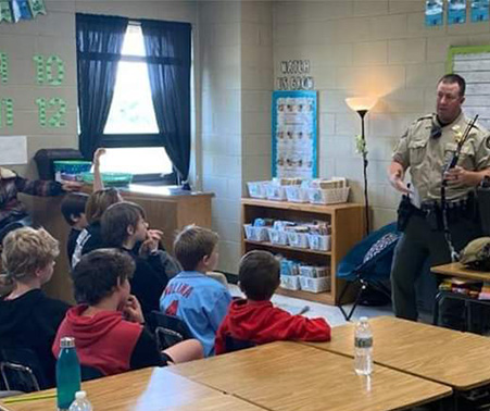 Matt Roberts speaking to a school classroom